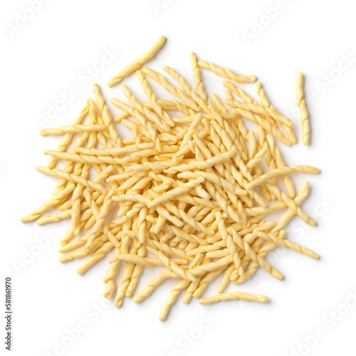 Heap of uncooked talian trofie pasta close up isolated  on white background