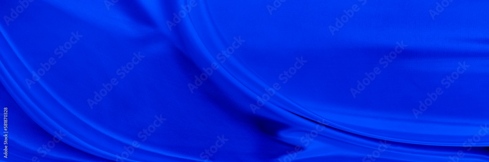 Black blue satin dark fabric texture luxurious shiny that is abstract silk cloth background with patterns soft waves blur beautiful.