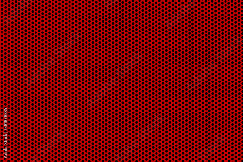 Background of wavy red metallic grid with holes. Perforated metal back. Metal mesh as background. photo