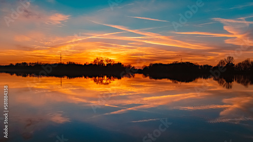 Sunset with reflections near Plattling, Isar, Bavaria, Germany