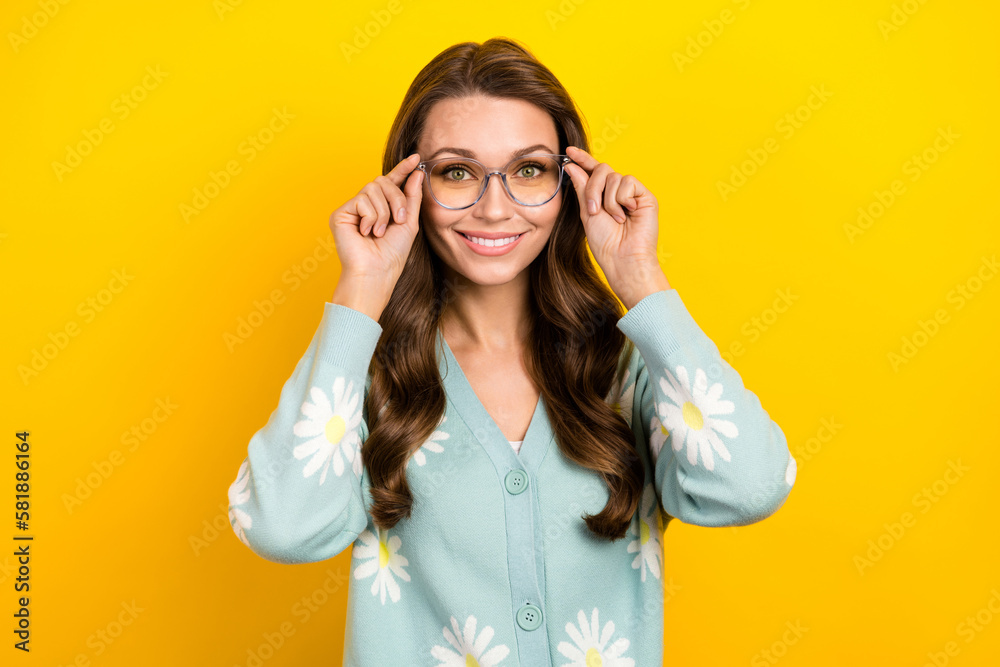 Photo of shiny charming lady dressed teal cardigan arms spectacles smiling isolated yellow color background