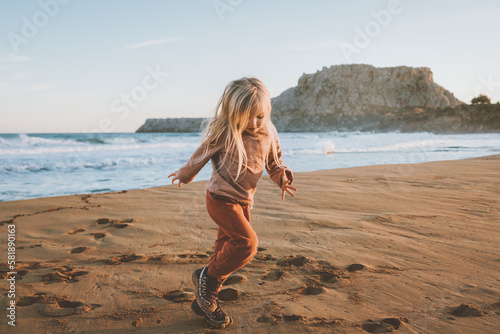 Photography Child girl playing on beach 4 years old kid family travel lifestyle vacations ou