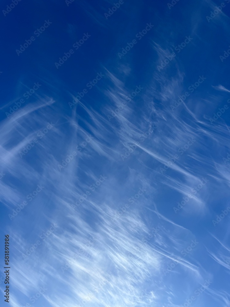 Blue sky with some white clouds stripes, natural heavens background Blue sky with some white clouds stripes, natural heavens background