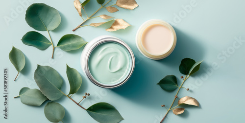 Top view cosmetic cream, jars with cosmetic cream and green leaves on table