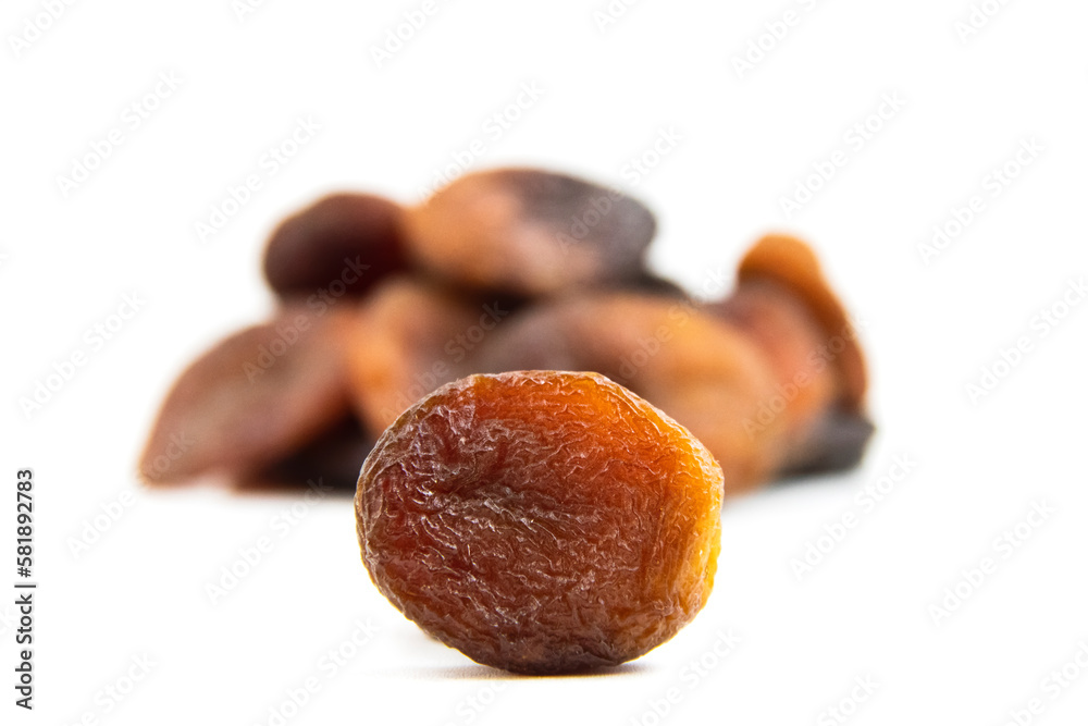 Brown dried apricots isolated on a white background. Brown dried apricots high resolution image. noise effect. Noise and Pollution Effect on photos. Top view. Brown dried apricots isolated on a white background. Brown dried apricots high resolution image. noise effect. Noise and Pollution Effect on photos. Top view.