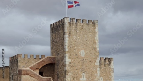 Ozama fortress with Dominican flag waving on top photo