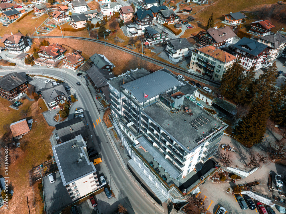 An aerial view of the luxury hotel in Grindelwald, Switzerland. Beautiful mountains in the background.