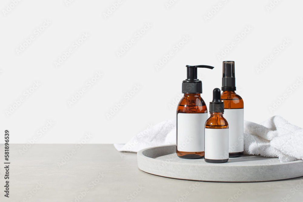 background with cosmetic products for body care. Gray bathroom. Means for massage.