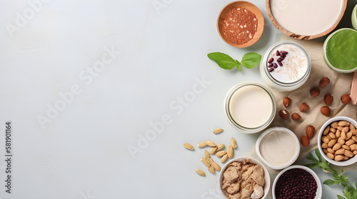 Various vegan plant based milk and ingredients, top view, copy space. Dairy free milk substitute drink, healthy eating. Generative Ai