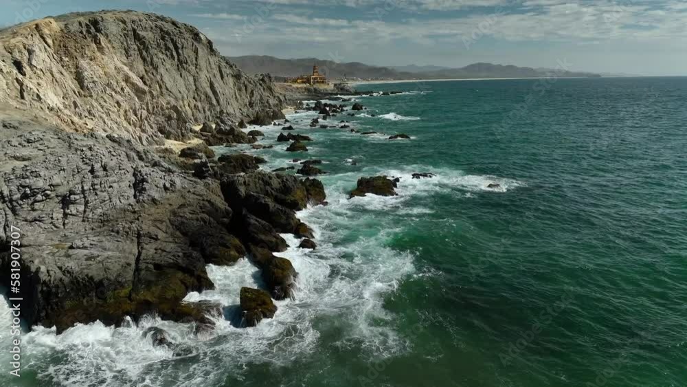 Waves crashing into cliffs todos santos