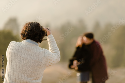 Photography couple looking at each other