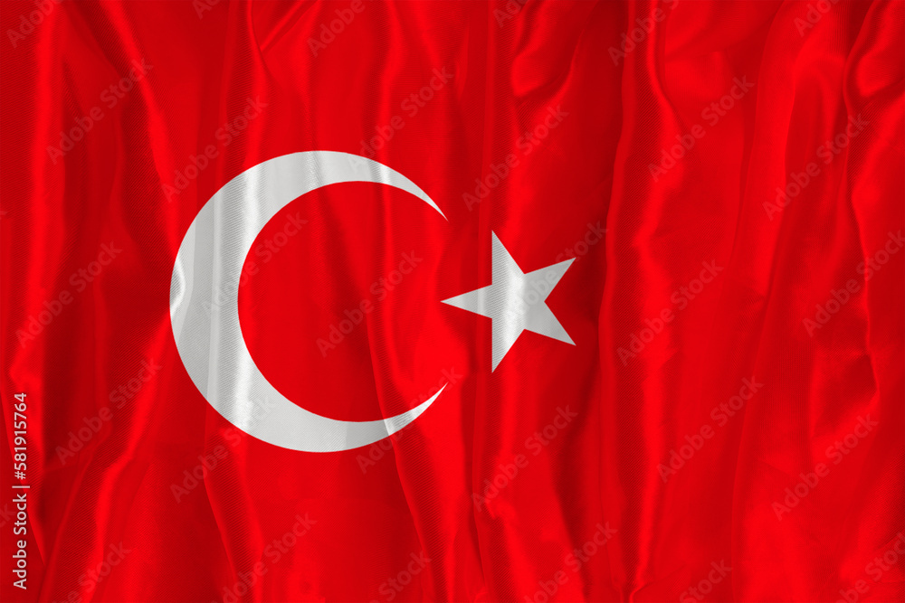 The flag of Turkey on a silk background is a great national symbol. Texture of fabrics The official state symbol of the country