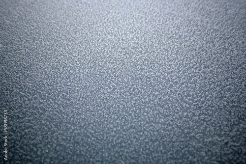 Top down Macro shot of Ice crystals on Car paint that looks like frozen carpet. Sharp in the center and soft focus around the outside.