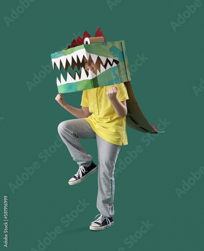 Little boy in cardboard din...