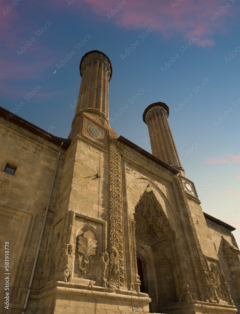 Twin Minaret Madrasa at sunset time ( Turkish: Çifte Minareli Medrese ).  Turkish islamic architecture. Erzurum, Turkey. 