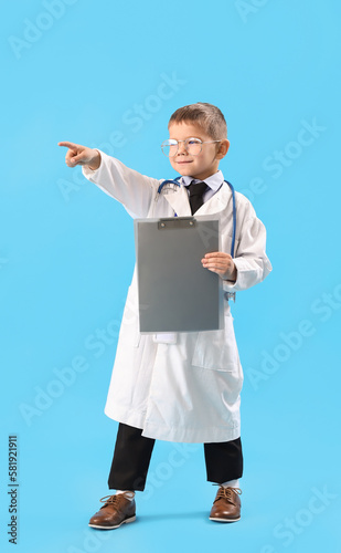 Cute little doctor with cli...