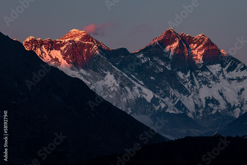 Pink sunset at Lhotse and Nuptse with marshmallow cloud over Mount Everest 