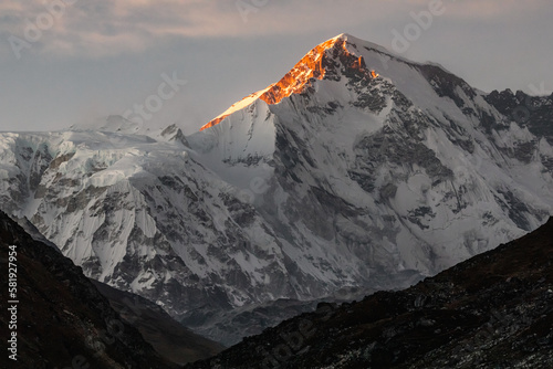 Stunning sunset on Cho Oyu (8188m) in late afternoon. Photo taken from Gokyo village. photo