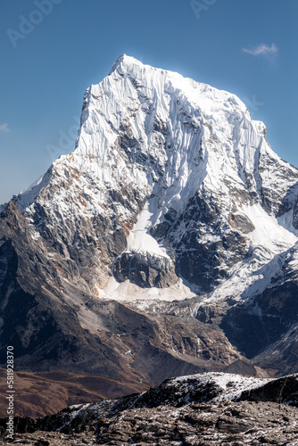 Snow covered west face of Cholatse (6440m), seen during crossing of Renjo-La pass and descending to Gokyo
