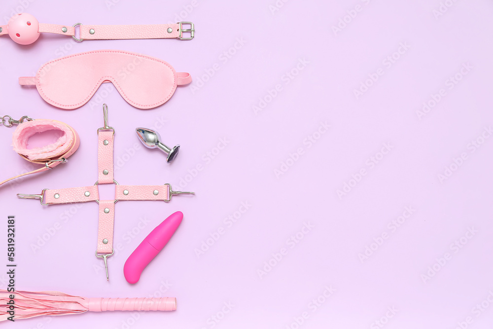 Different sex toys on lilac background