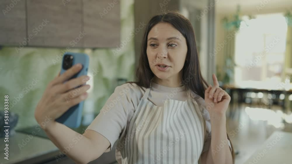 Blogger girl leads live broadcast welcomes audience and talks about useful products on phone camera. Slow motion Blogger girl leads live broadcast welcomes audience and talks about useful products on phone camera. Slow motion