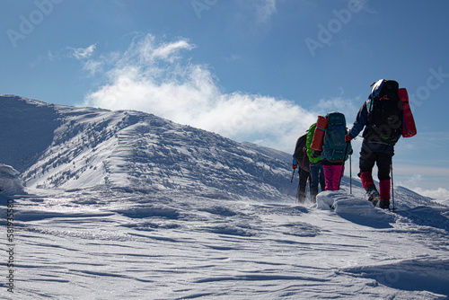 hikers in winter mountains