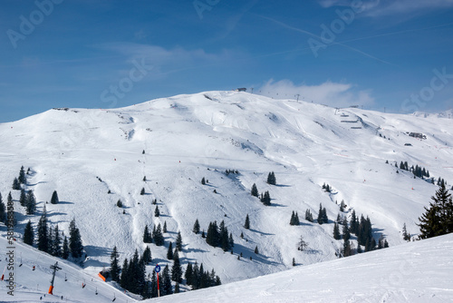 Ski resort with slopes in Austrian Alps in winter with snow.
