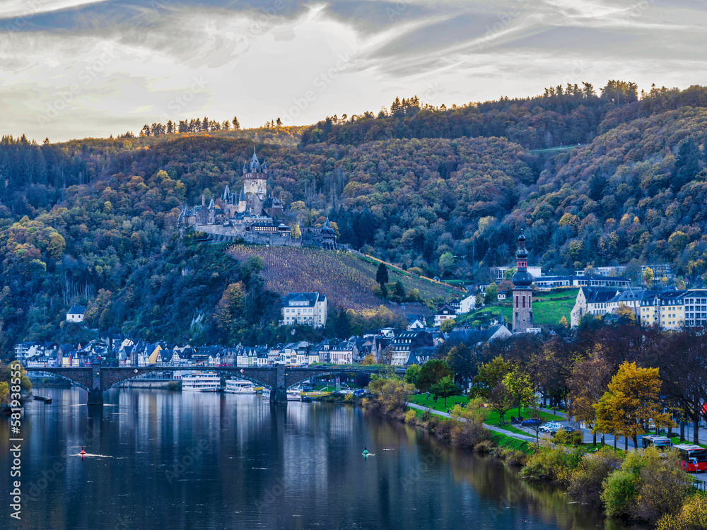 Long exposure shot of Cochem town and castle in the afternoon during colourful autumn season in Cochem-Zell district, Germany