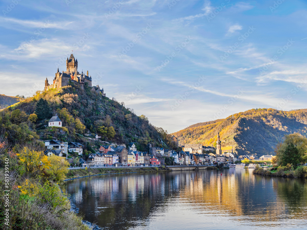 Riverside shot of Cochem town and castle in the afternoon during colourful autumn season in Cochem-Zell district, Germany