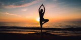 yoga on the beach warrior pose silhouette 