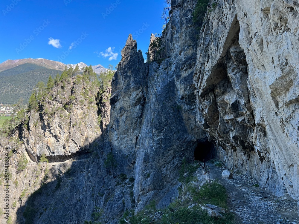 An attractive hiking trail through the rocks of the Schaftobelbach alpine canyon and to the Schaftobelfall waterfall, Alvaneu Bad (Alvagni Bogn) - Canton of Grisons, Switzerland (Schweiz) An attractive hiking trail through the rocks of the Schaftobelbach alpine canyon and to the Schaftobelfall waterfall, Alvaneu Bad (Alvagni Bogn) - Canton of Grisons, Switzerland (Schweiz)