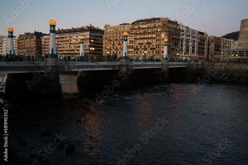 Evening walk along river in central part of Donostia or San Sebastian city, Basque Country, Spain