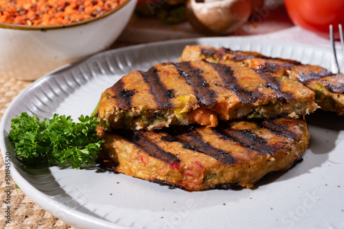 Barbecue grilled tasty vegan and vegetarian burgers made from fresh vegetables and dried legumes and beans