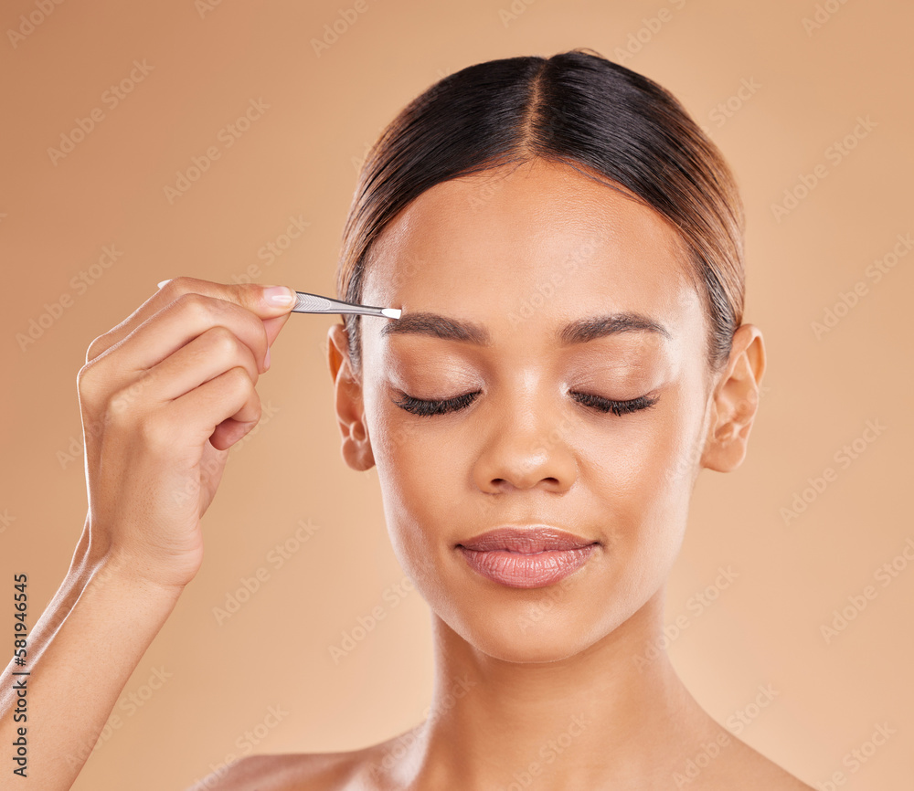 Beauty, grooming and eyebrows with woman and tweezers in studio for clean, self care and cosmetics. Facial, plucking and shape with female model on brown background for hair removal and skincare Beauty, grooming and eyebrows with woman and tweezers in studio for clean, self care and cosmetics. Facial, plucking and shape with female model on brown background for hair removal and skincare