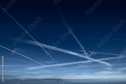 Blue Sky With Grid Of White Condensation Trails, Contrails, From Airplane