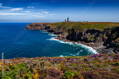 Cliffs At Atlantic Coast With Ancient Lighthouse At Cap Frehel In Brittany, France; Phare du Cap Frehel
