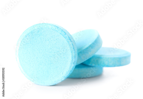 Blue soluble tablets isolated on white background