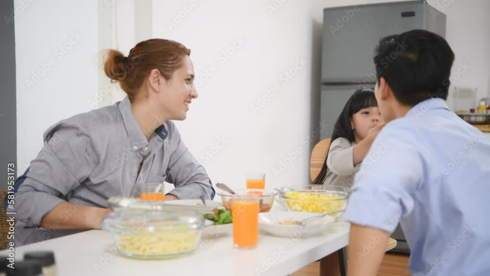 Holiday concept of 4k Resolution. Asian family and daughter eating together in the house. Holiday concept of 4k Resolution. Asian family and daughter eating together in the house.
