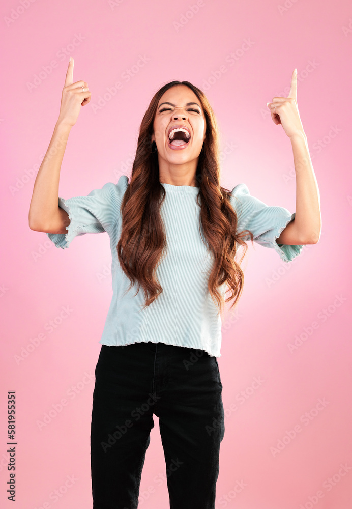 Pointing, mockup and woman on pink background with excited, smile and celebrate on copy space for good news. Advertising, hands and isolated in studio for product placement, promotion or announcement