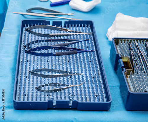 Ophthalmic Surgical Instruments. Ophthalmic surgery instrument set in container. Ophthalmic surgical instruments and surgical supplies surgeons use for ophthalmic procedures. photo