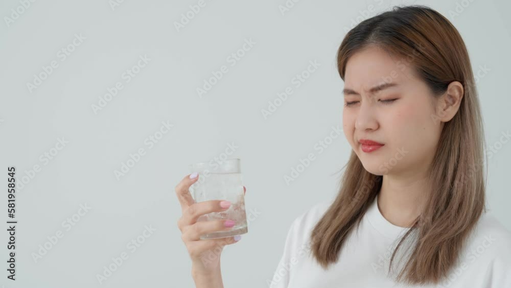 Asian woman feel sensitive teeth after drinking cold, female suffer tooth, decay problems, dental care, tooth extraction, decay problem, bad breath, Gingival Recession, Oral Hygiene instruction Asian woman feel sensitive teeth after drinking cold, female suffer tooth, decay problems, dental care, tooth extraction, decay problem, bad breath, Gingival Recession, Oral Hygiene instruction