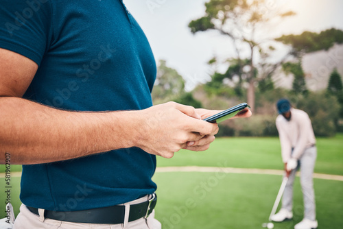 Man, hands and phone texting in communication on golf course for sports, social media or networking outdoors. Hand of sporty male chatting on smartphone or mobile app for golfing research or browsing © Clayton D/peopleimages.com