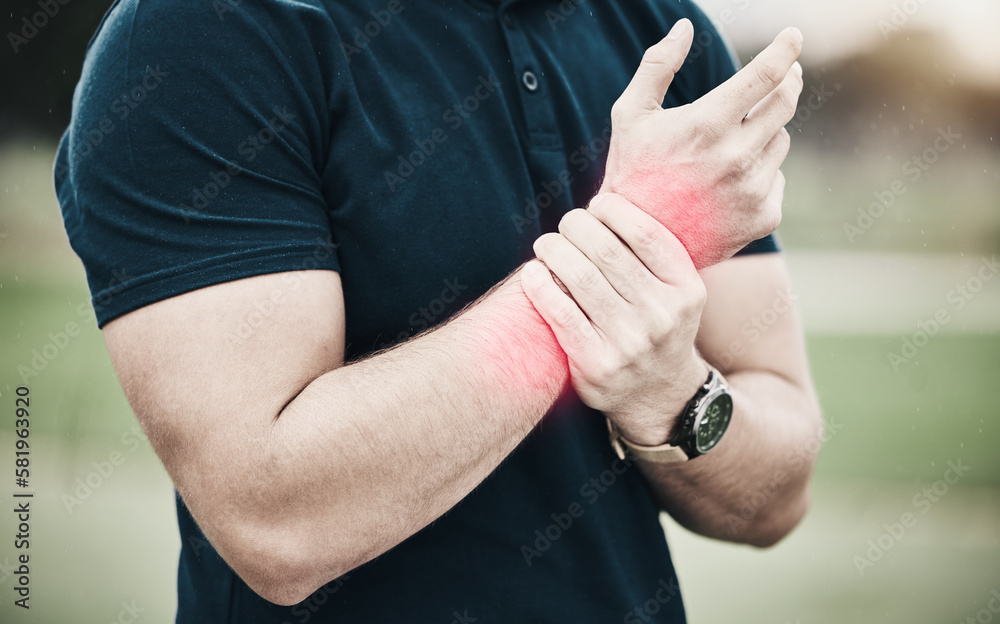 Sport, injury and golf, man with wrist pain during game on course, massage and outdoor relief in health and wellness. Green, hands on arm in support and golfer with ache from swing in golfing workout