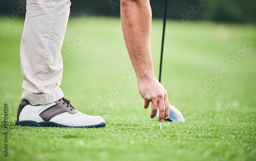 Sports, golf ball and tee with hand of man on course for training, tournament and challenge. Start, competition match and ready with athlete and club on grass field for action, games and hobby