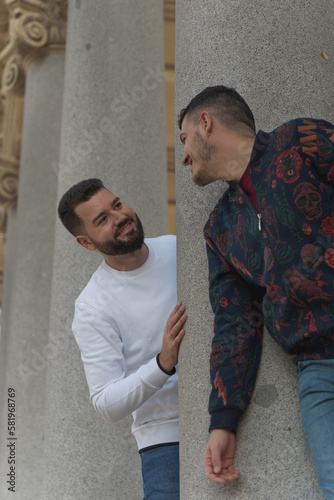 gay couple in the park, walking happily, loving and playful
