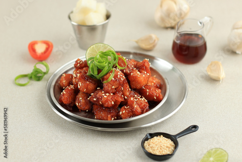 Korean Fried Chicken Yangnyeom Tongdak with Spicy Sauce and Sesame Seed photo