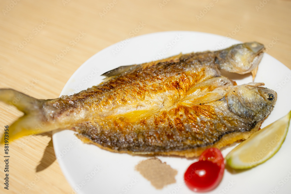 Delicious grill fish dish in restaurant Delicious grill fish dish in restaurant