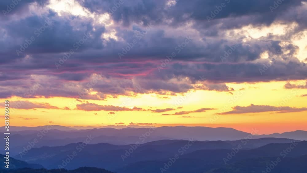 Cloudy weather over hills covered with spruce forests in Rhodope Mountains and fog between mountain ranges Cloudy weather over hills covered with spruce forests in Rhodope Mountains and fog between mountain ranges