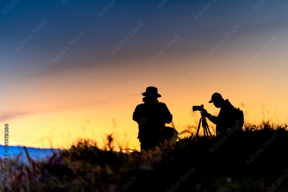 Silhouettes of photographers while patiently waiting for dawn in the mountains of Da Lat, Lam Dong province, Vietnam