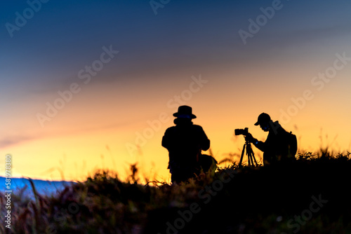 Silhouettes of photographers while patiently waiting for dawn in the mountains of Da Lat  Lam Dong province  Vietnam